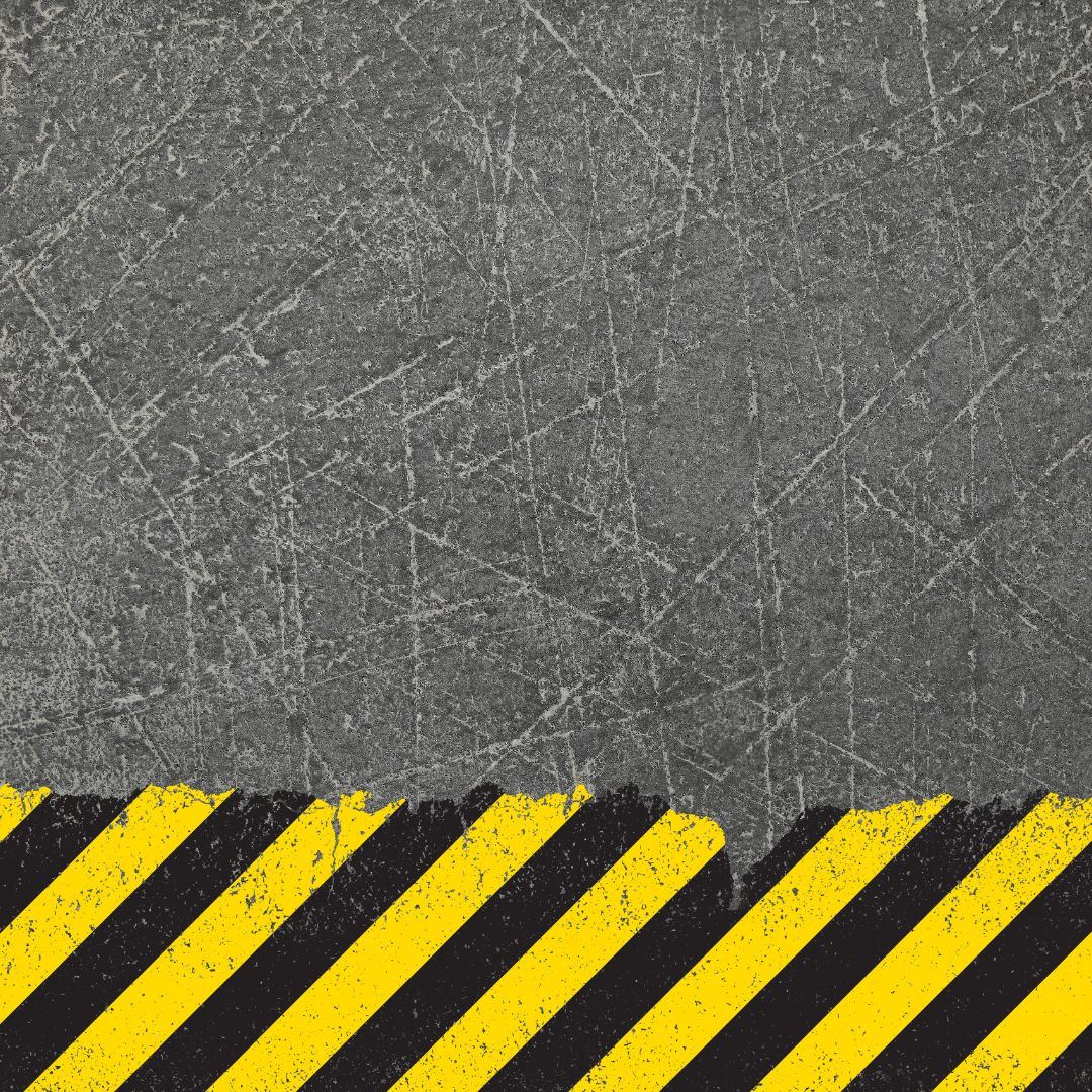 Asphalt background with black and yellow stripes